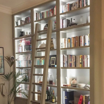 Home Library idea, tall shelving with ladder, floor level cabinets, lighting systems