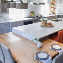 Island with seating and table attached with lower level seating.