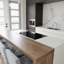 Island with hob on work area, additional timber seating area.