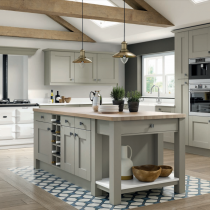 Shaker style kitchen with large island, range and mantle feature.