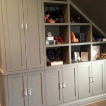 Under the stairs, cabinets & shelving to make the most of this space