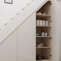 Under the stairs, cabinets & shelving to make the most of this space