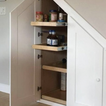 Under the stairs, cabinets & shelving to make the most of this space