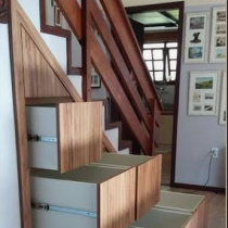 Under the stairs, cabinets & shelving to make the most of this space