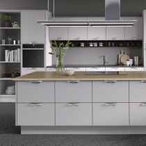 Flat doors, large island with storage, single ovens on either side of kitchen.