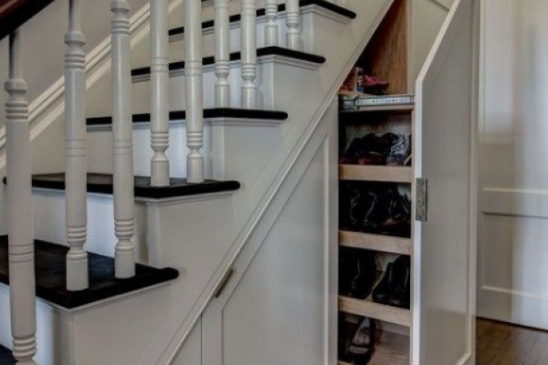 Under the stairs, cabinets & shelving to make the most of this space